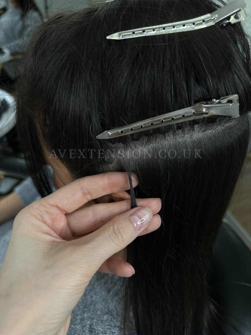 Applying a flat micro bond to a fine short section of hair, AV Extension studio London